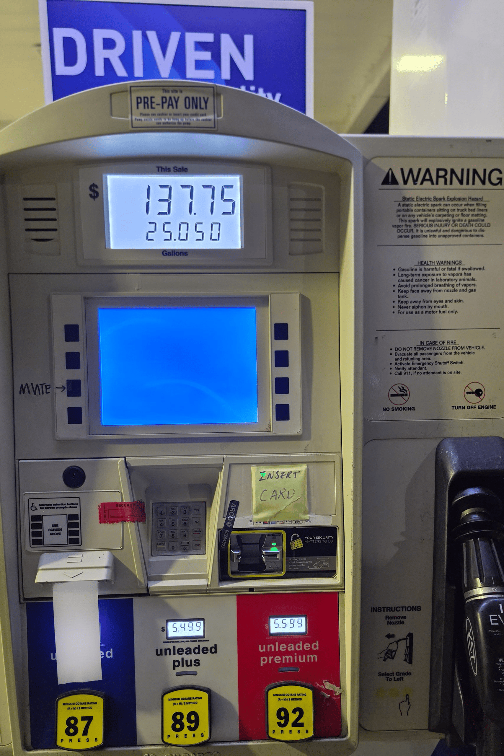 A gas pump display showing a 7.75 purchase of 25.050 gallons at a Kingston, Washington, station.