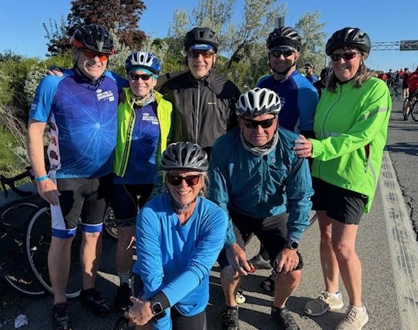 Group of cyclists posing together outdoors. Group of cyclists posing together outdoors.