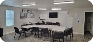 Room for providing OSHA training. Has table and charis