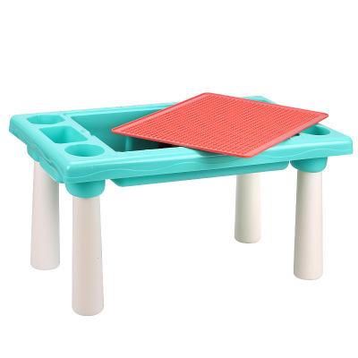 Beautiful Toddler Boy Sitting On Puzzle Eating Small Colored Chocolate Balls At Kindergarten Stock Photo Download Image Now Istock