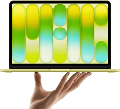 MacBook Neo in citrus color, balanced on fingertips of open hand, screen displaying colorful abstract pattern
