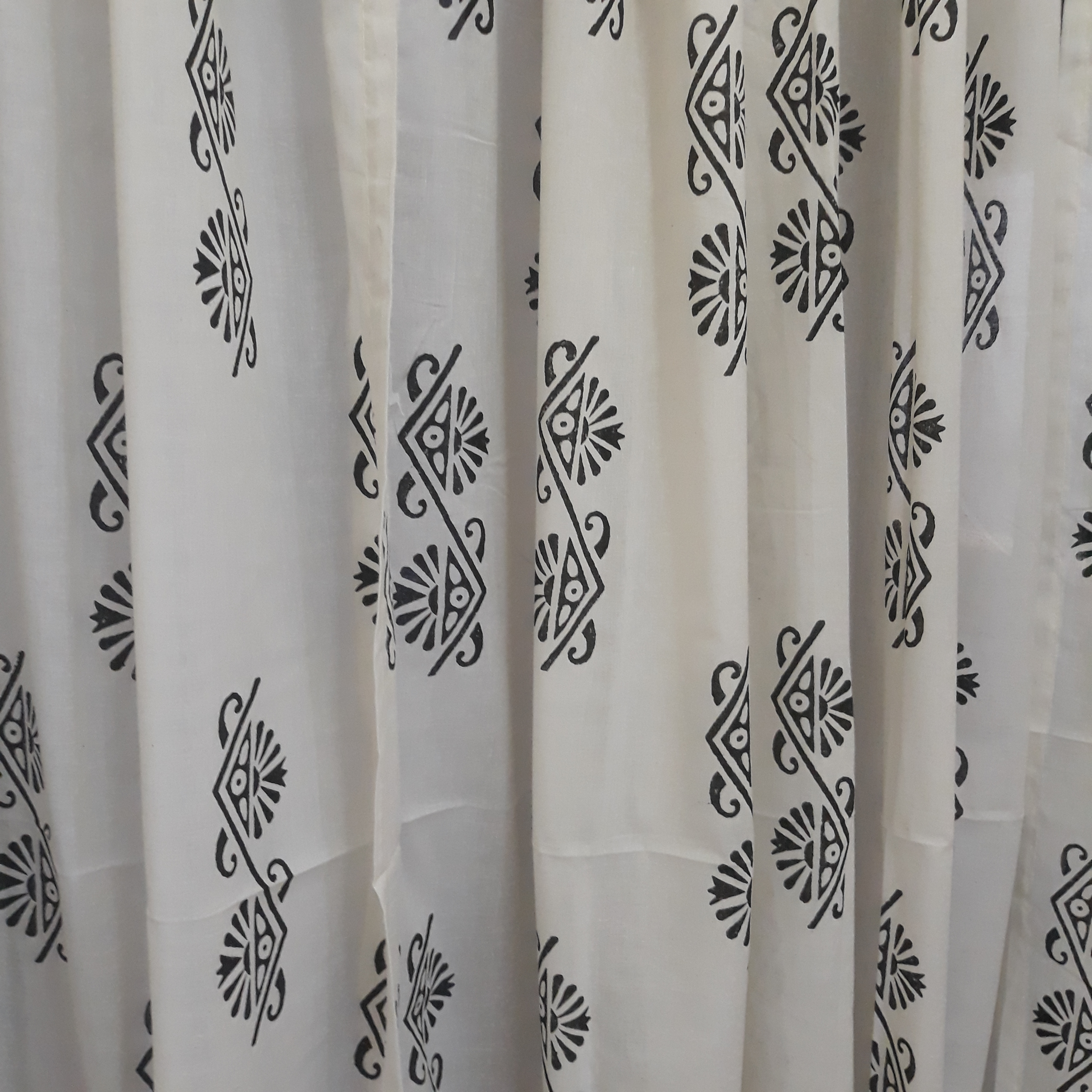 block printed motifs on a sheer white cotton decorative window curtain