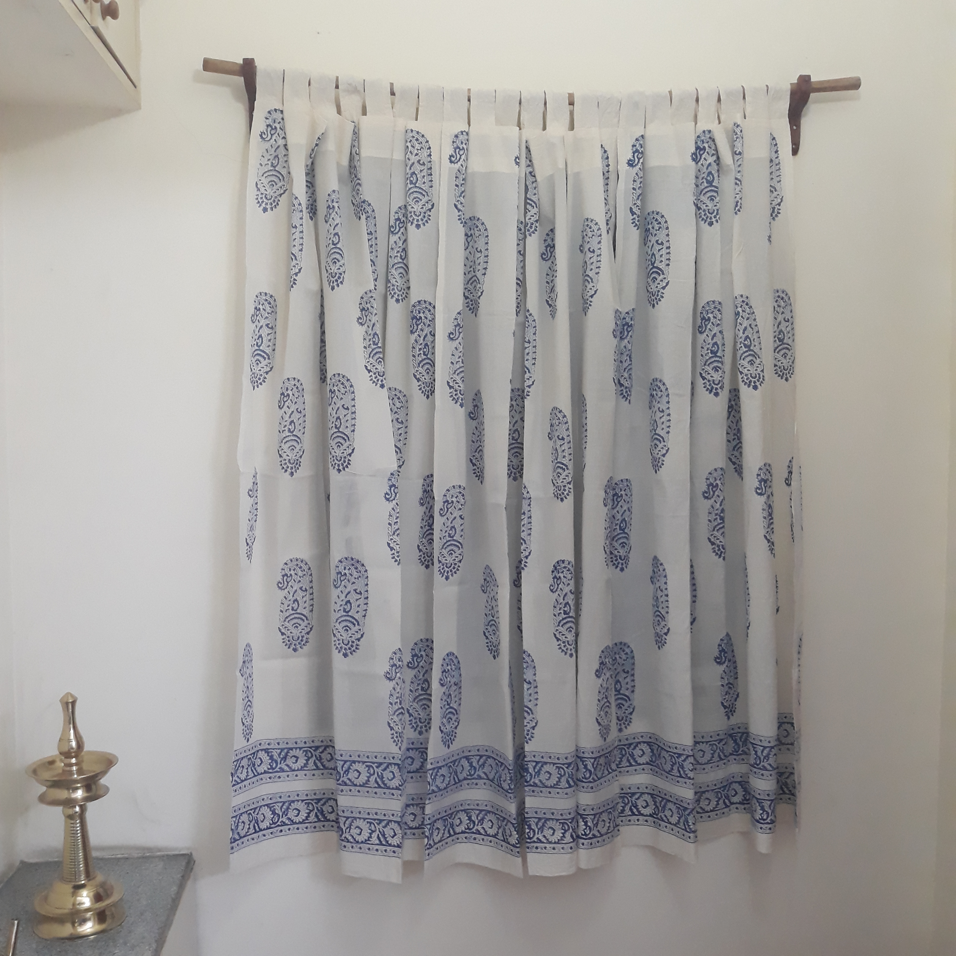 Sheer cotton window curtains for decorative living rooms block printed with blue paisleys