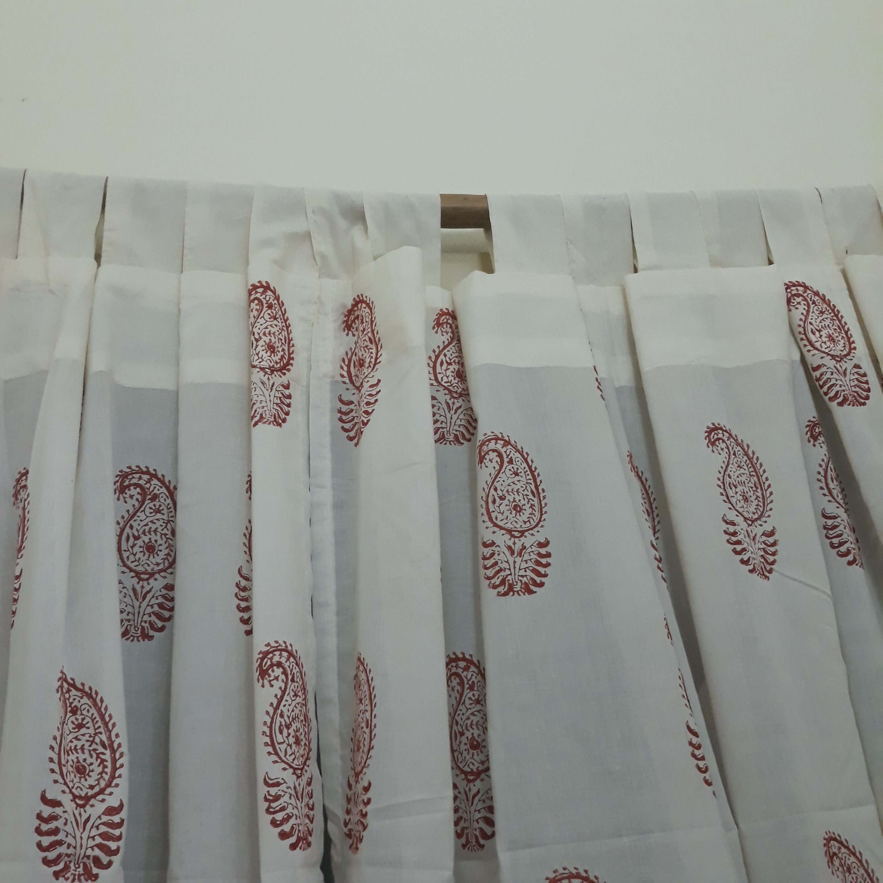 Loops tailored on a sheer cotton window curtain