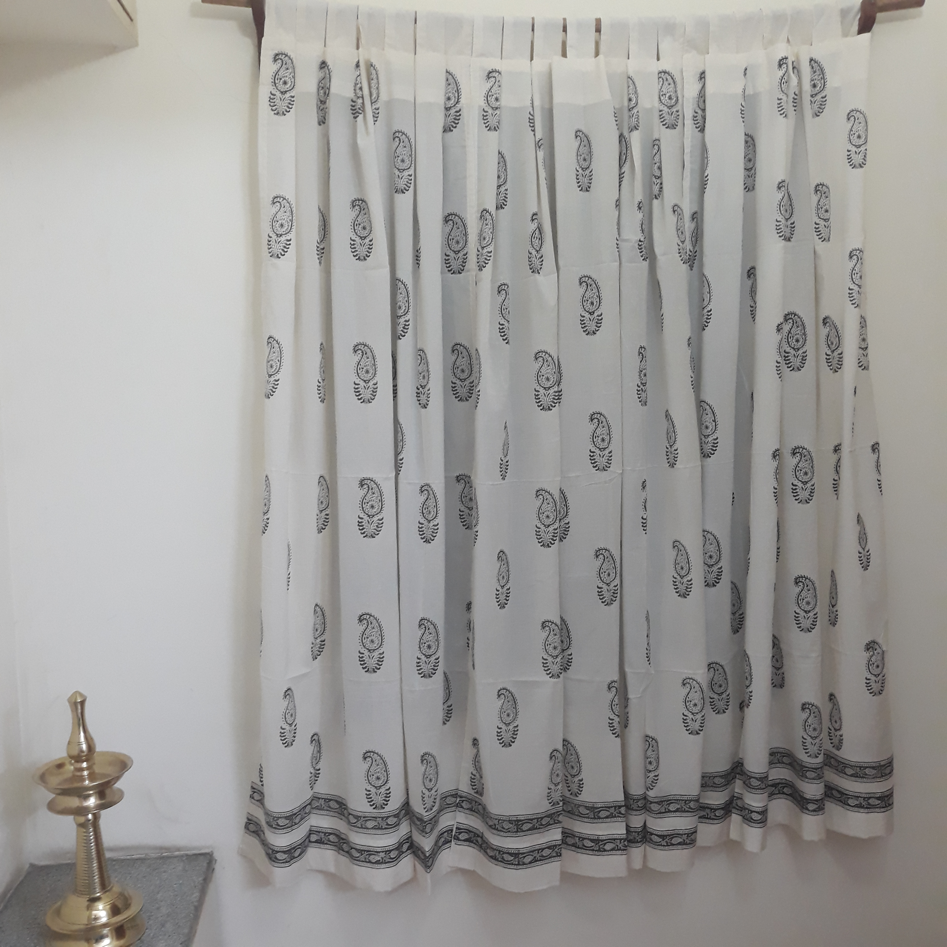 Paisleys block printed on a sheer white cotton window curtain