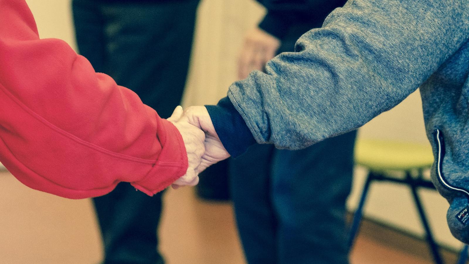 Elders holding hands - changingaging.org
