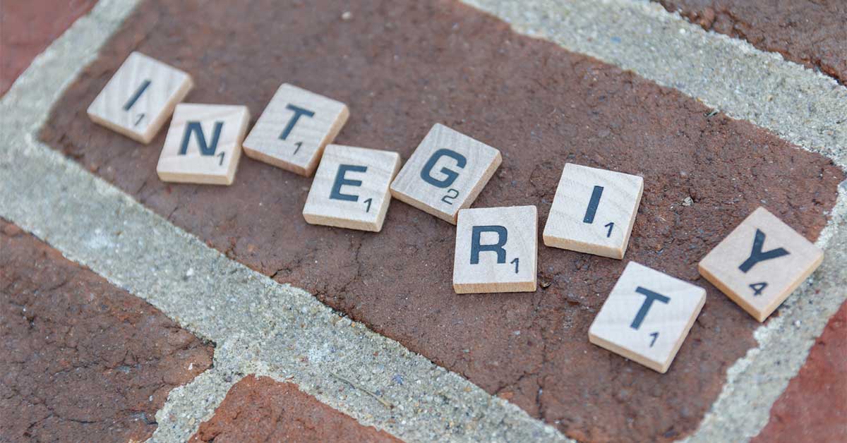 Integrity - Scrabble Pieces on Brick - ChangingAging.org