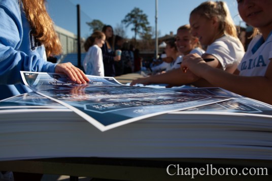 IMG_9457 Carolina players sign autographs after defeating Maryland at Dorrance Field in Chapel Hill on Saturday, February 22. (Dakota Moyer/Chapelboro.com)