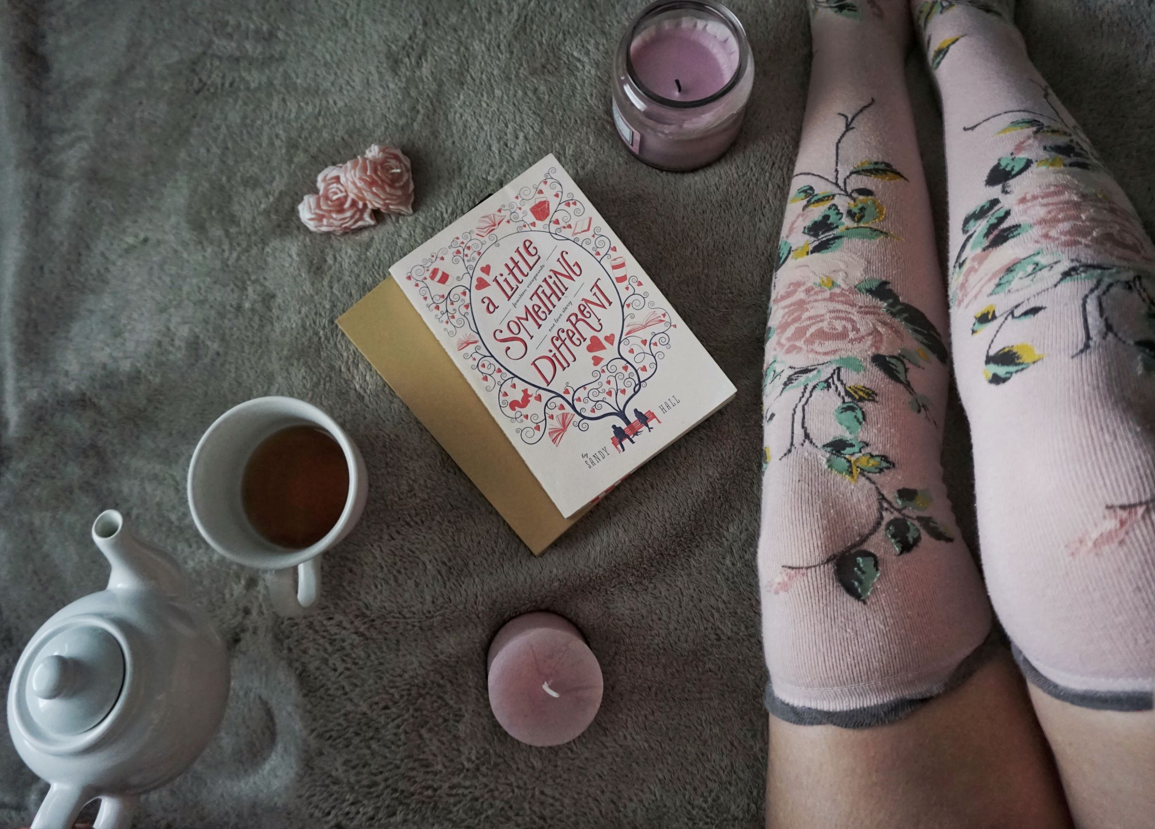 book picture with pot and cup of tea and pink overknees