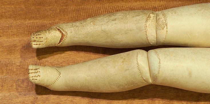 Split in Leather of Antique Doll Body
