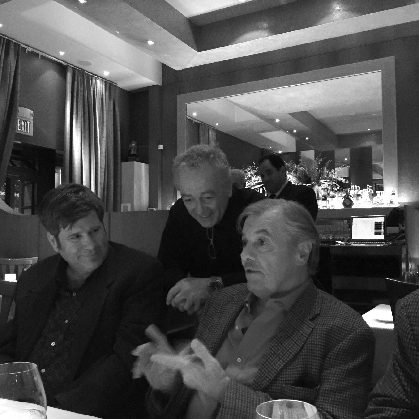 Jacques and Roland discuss the desserts, while Mitch looks on