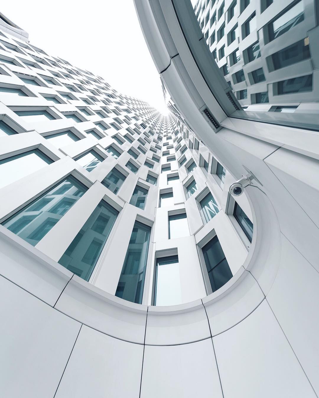 white building with windows by photographer jumpingsole