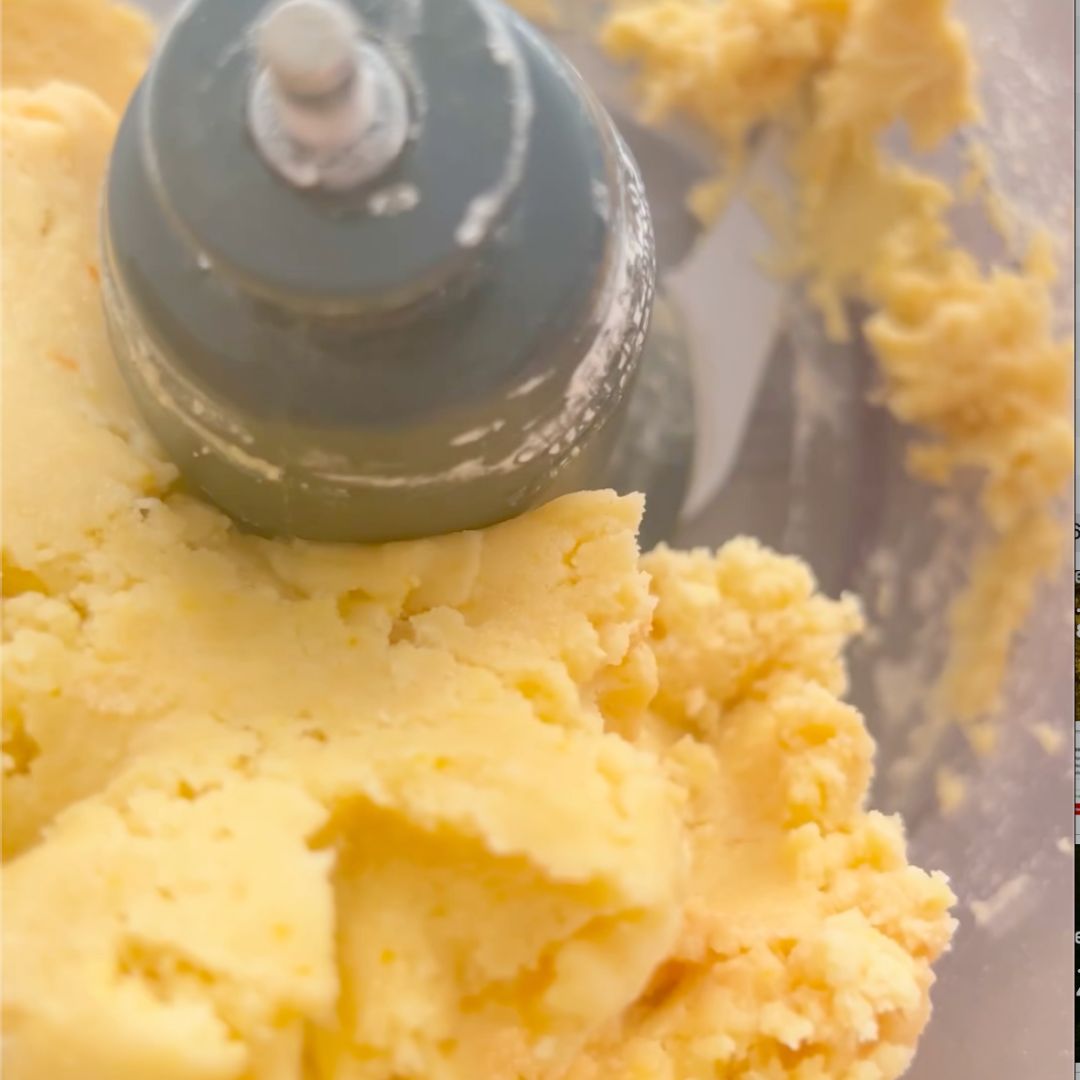 The tart dough is ready when it comes together in a big mass in the food processor.