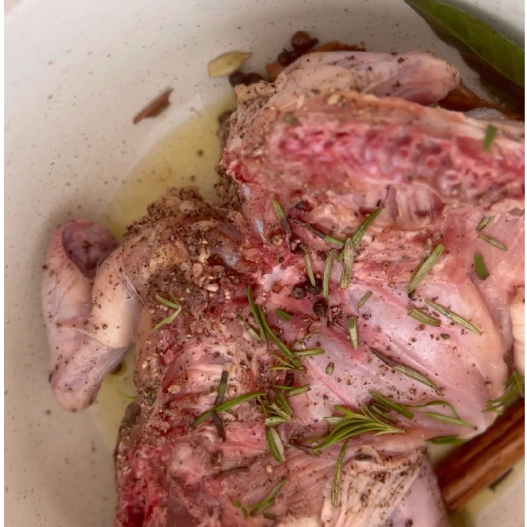 Brown the chicken in hot ghee, spices.