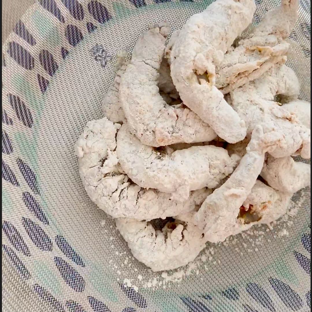 Shake off excess flour before frying.