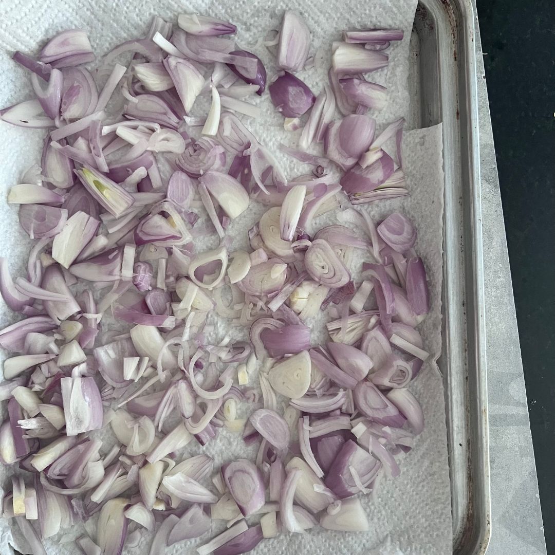 Air dry sliced shallots over absorbent paper.