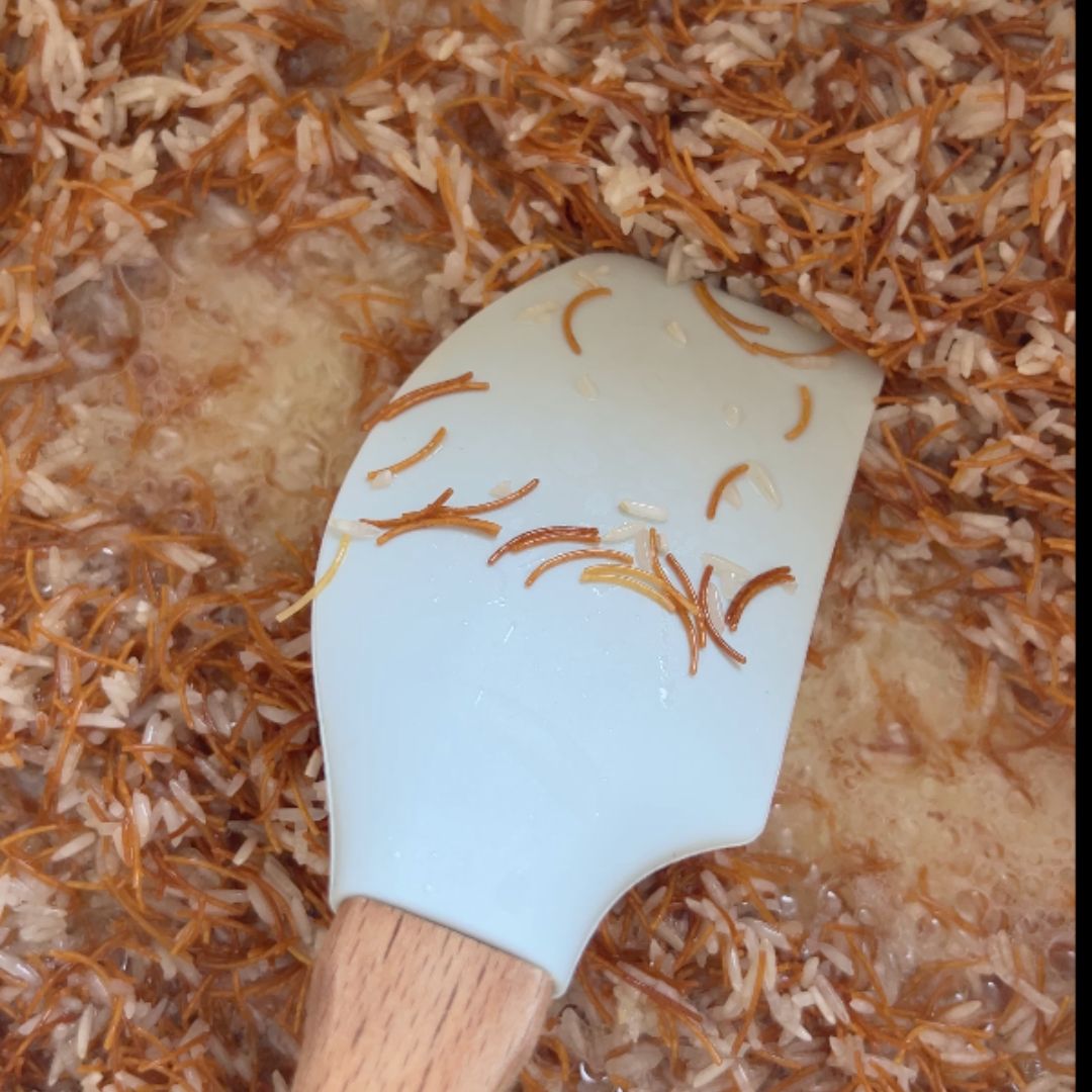 Add the rice, stir and coat with the oil.