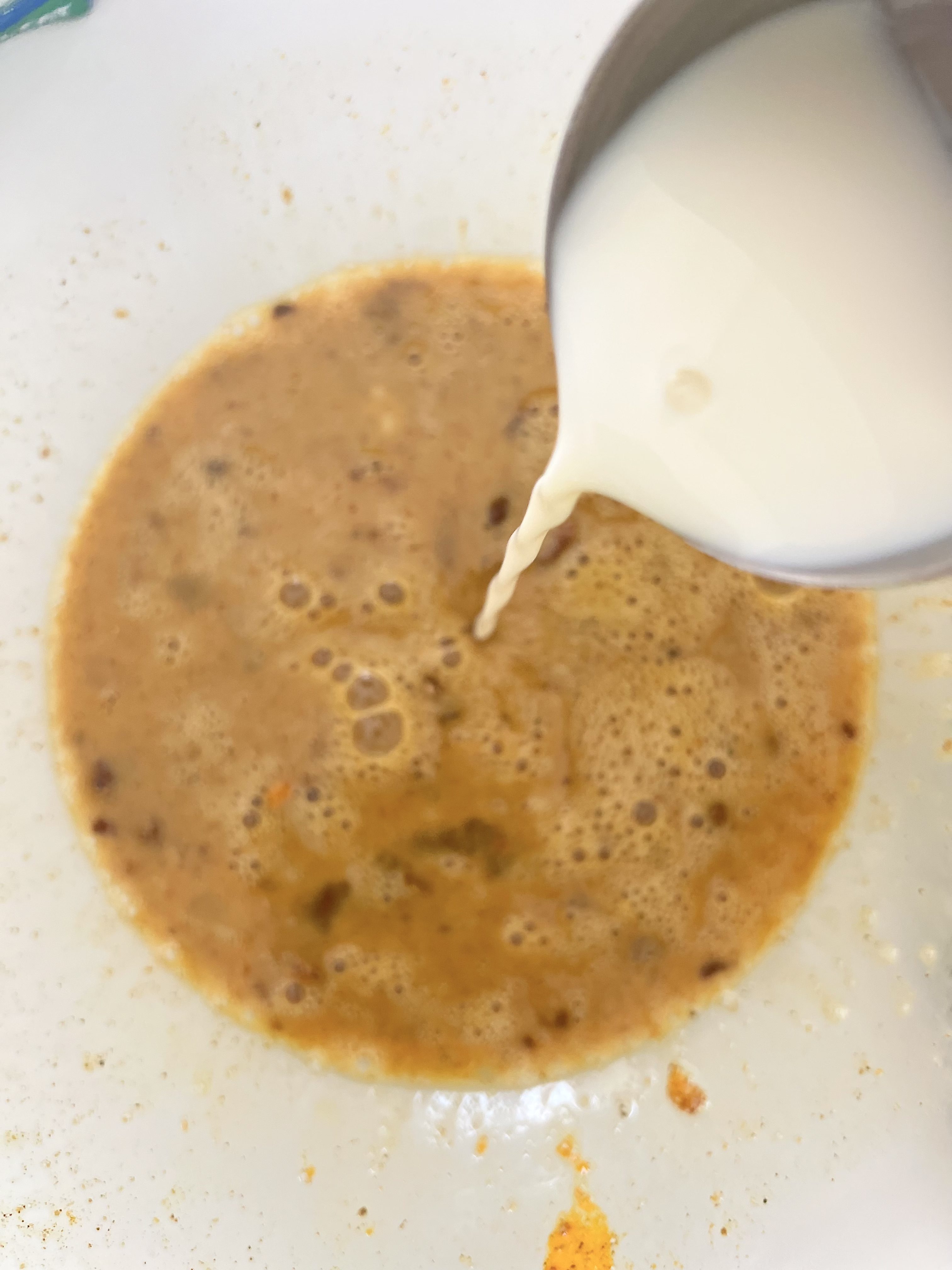 Step 6: Stir in milk and whisk again.