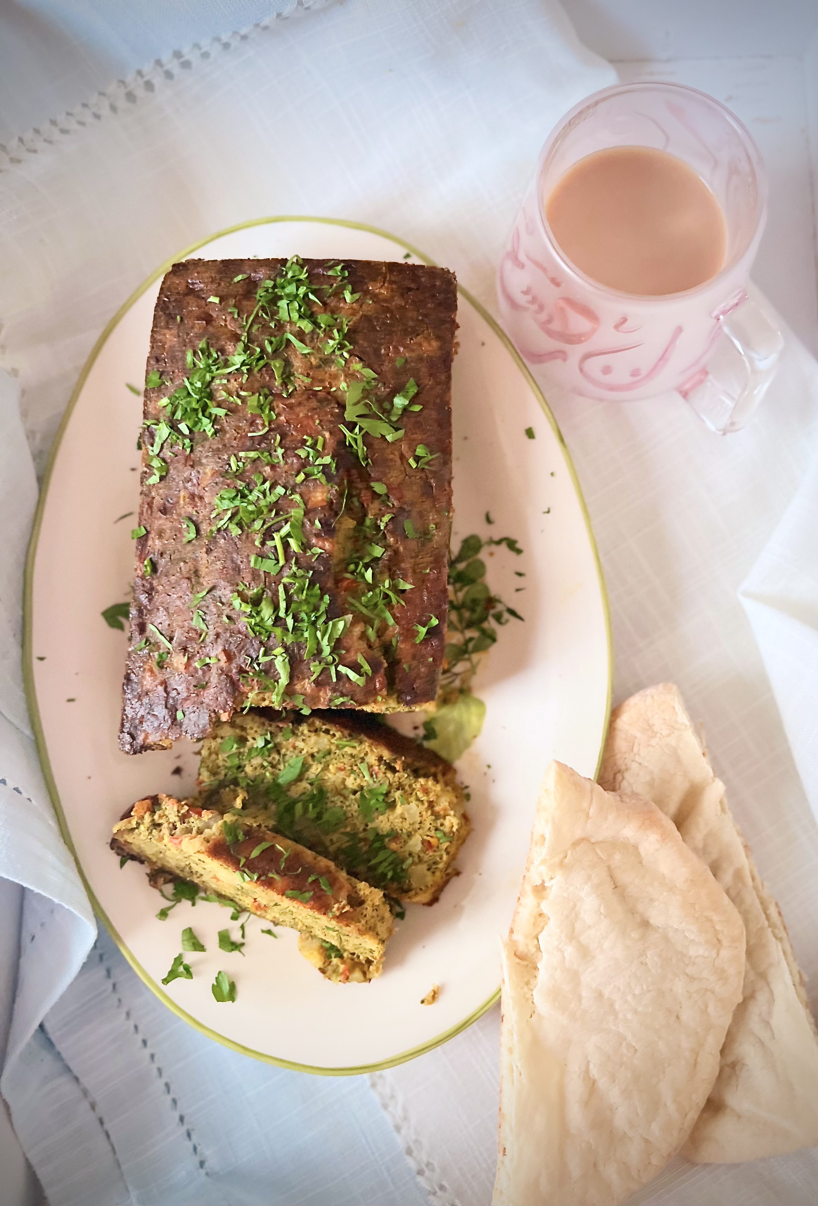 Step 12: Slice and serve with warm pita bread.