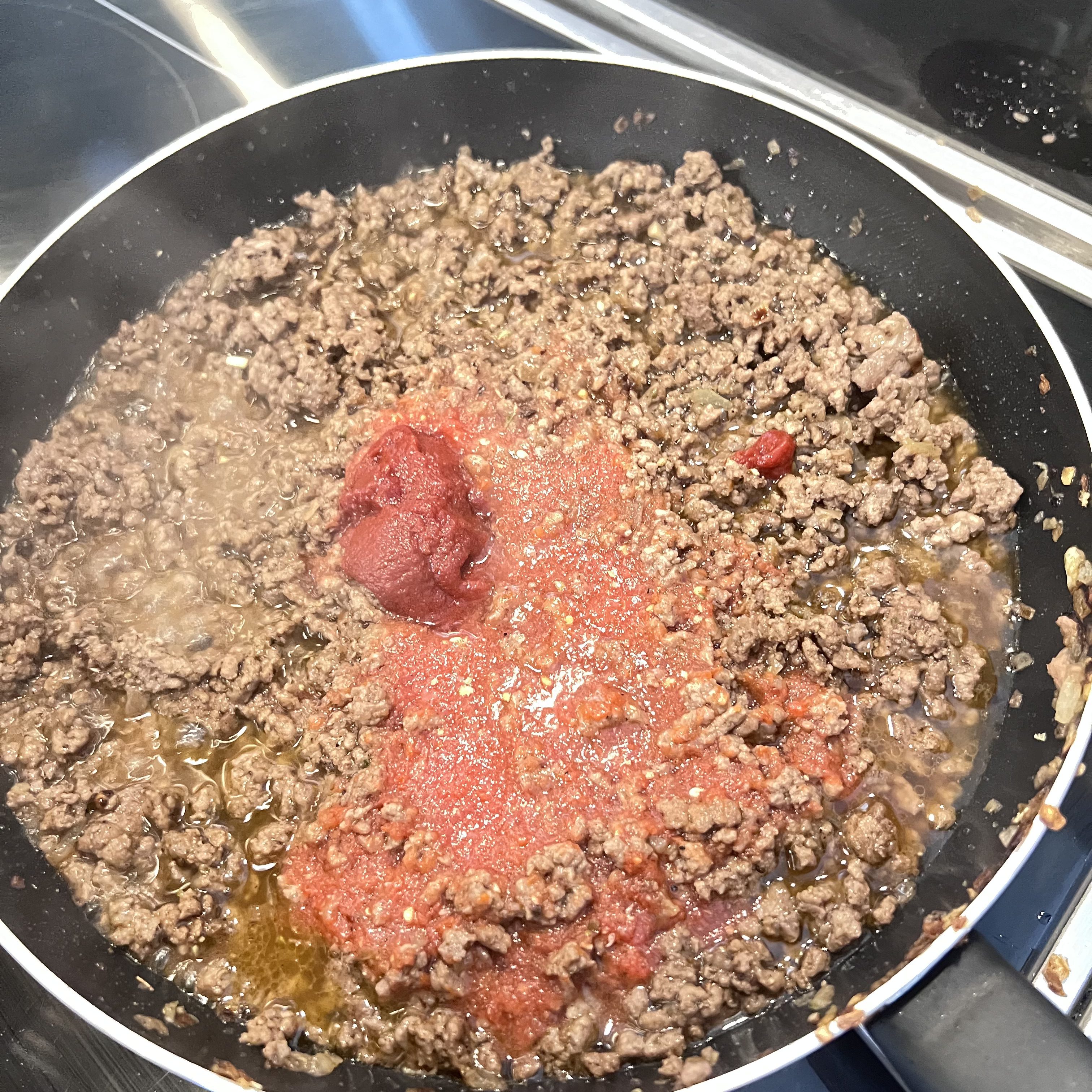 Let the meat absorb Its juices totally before adding the tomato sauce and tomato paste.