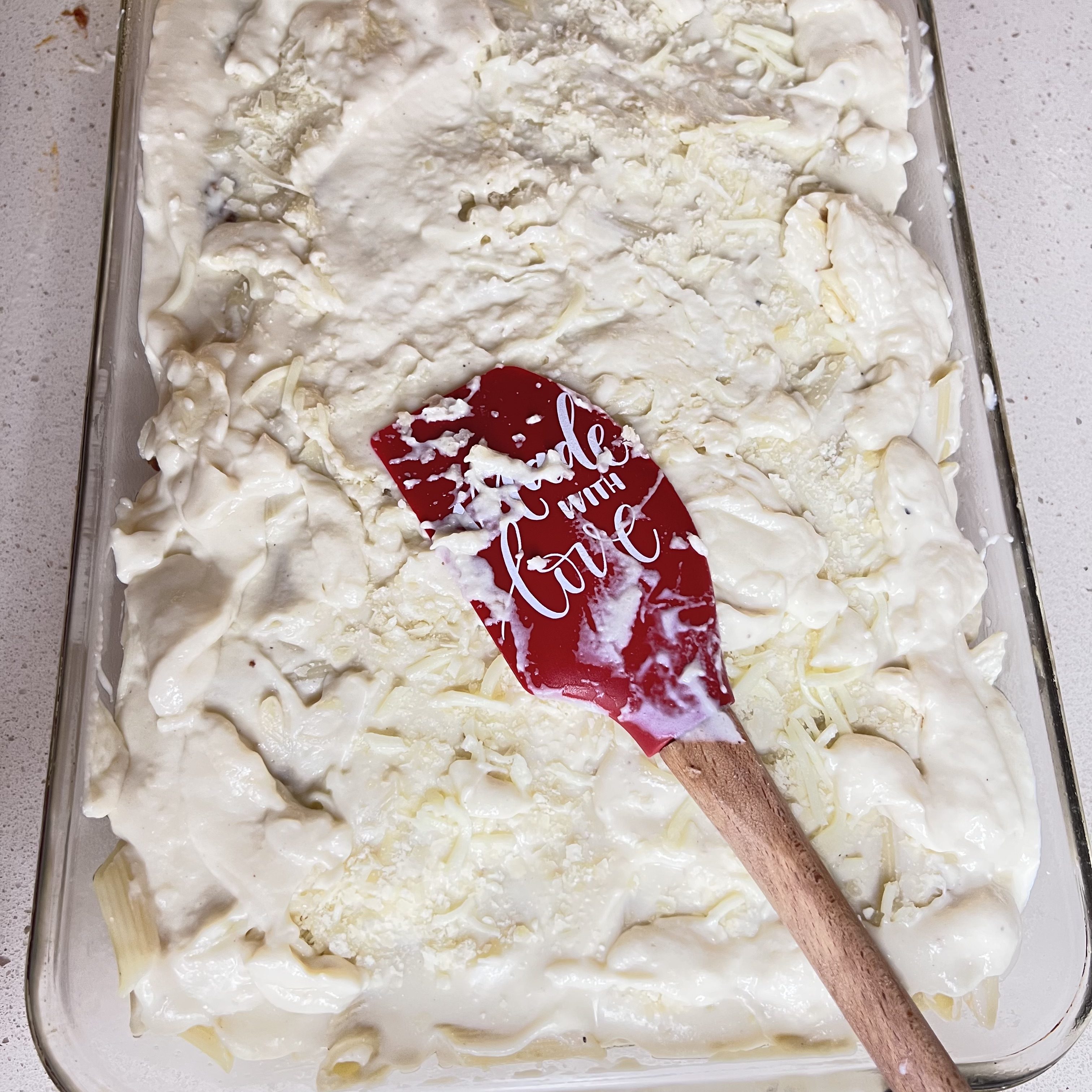 For a golden crust, generously sprinkle a layer of mozzarella and parmesan cheese on top.