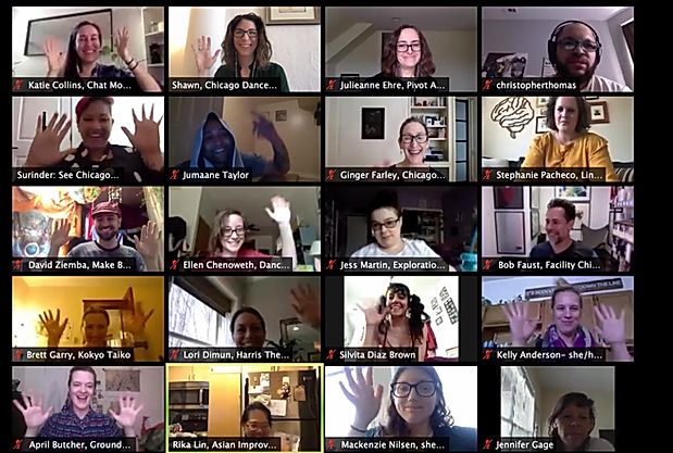 A screenshot from a zoom call with some participants waving and smiling.