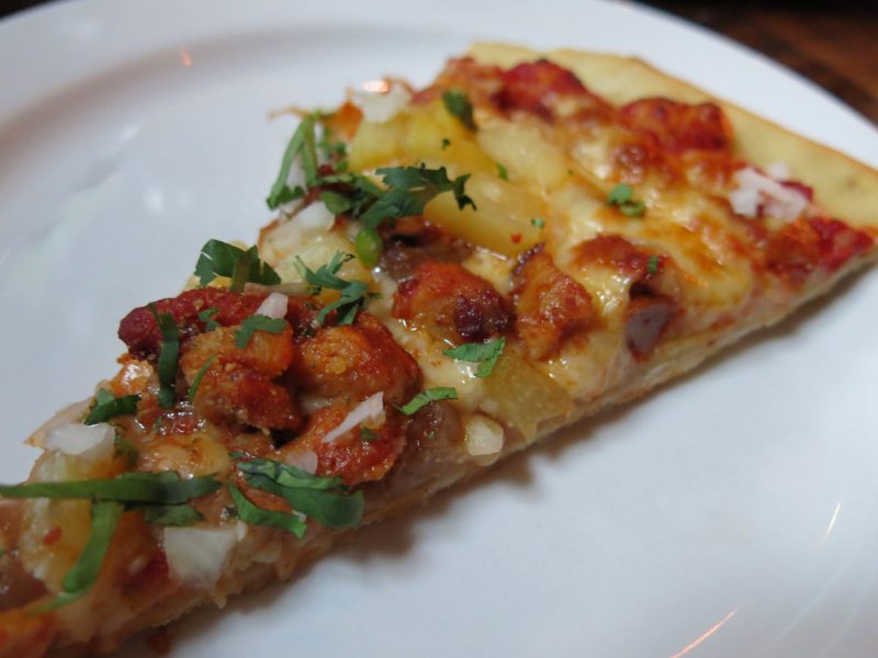 Gino's East Hosts Chicago Craft Beer Week Tap Takeover 14 Craft beer Pineapple Imposter served with pizza