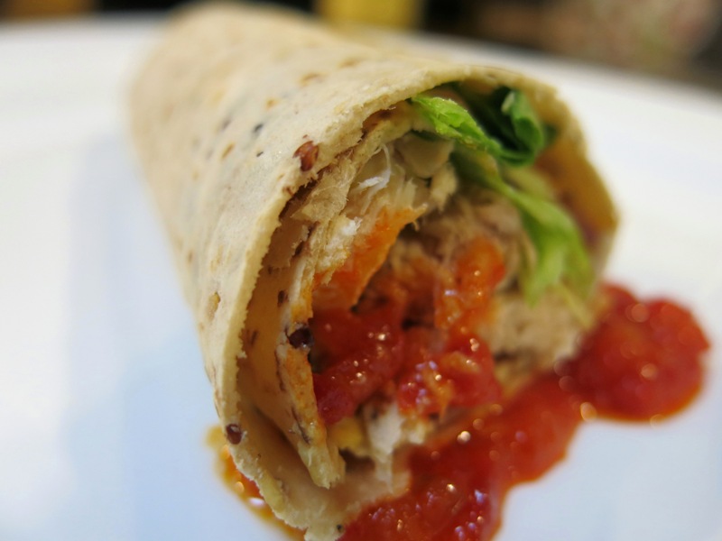 Close-up of a BFree wrap with chicken and lettuce
