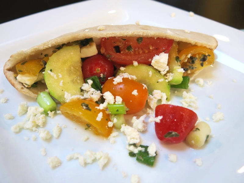 Close-up of BFree pita filled with Greek salad