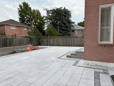 Interlocking patio, stone steps and flower bed Installation in Richmond Hill, Ontario by Canharmony Landscaping Inc.
