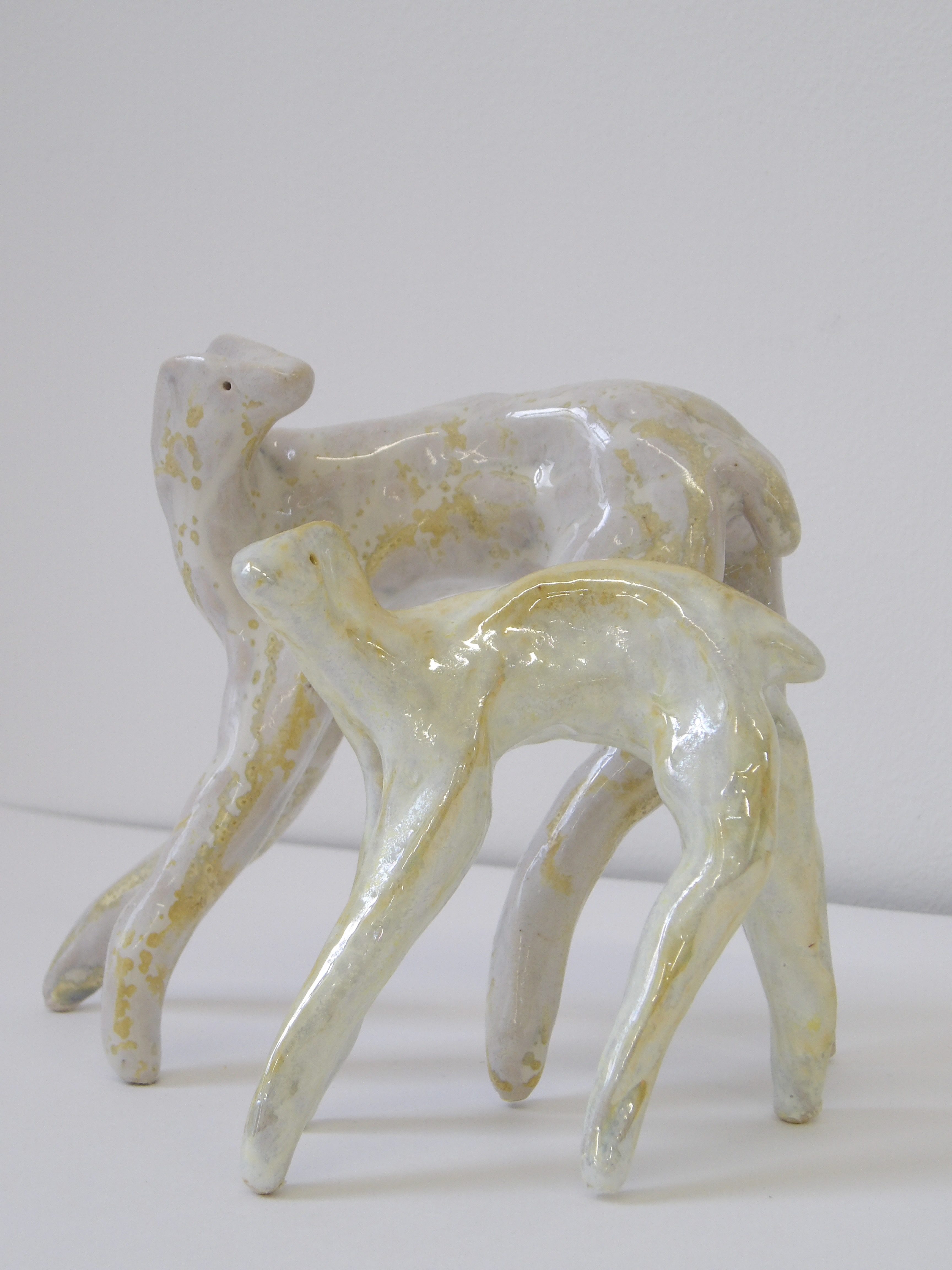 Two standing ceramic deer