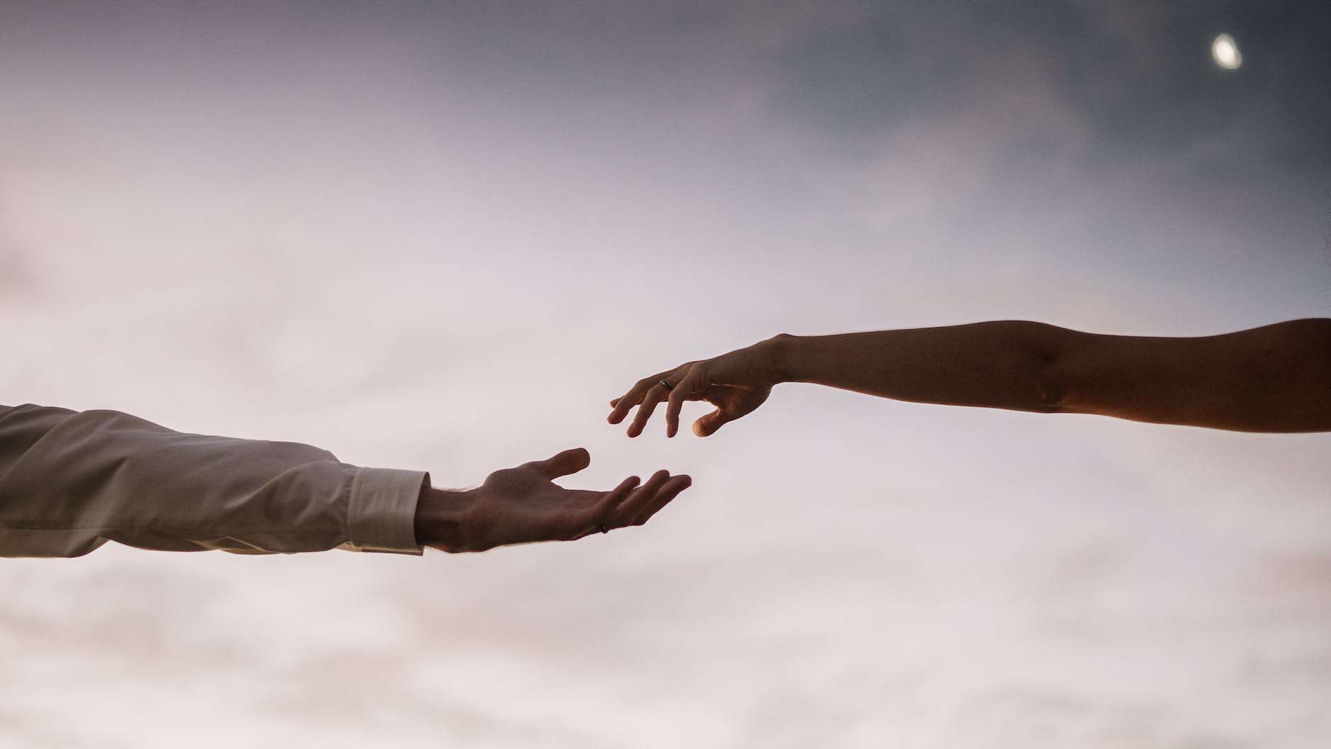 couple with hands apart