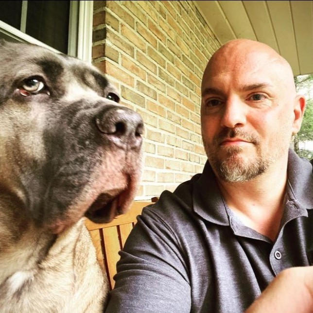 Professional headshot with a dog