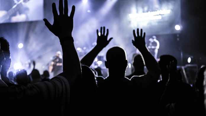 pexels-photo-952437-1 group of people raising hands silhouette photography