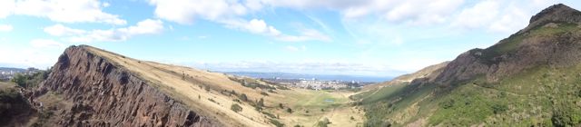 A panoramic of Salisbury Crags with Arthur's Seat to the right