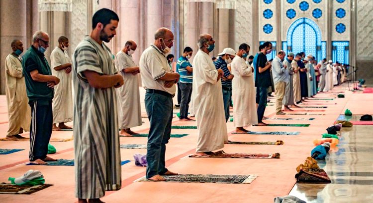 Muslim worshippers, mask-clad and distanced as precautions due to the (COVID-19 coronavirus pandemic, perform prayers at the Hasan II mosque, one of the largest in the African continent, in Morocco's Casablanca on June 16, 2020. (Photo by Fadel SENNA / AFP) (Photo by FADEL SENNA/AFP via Getty Images)