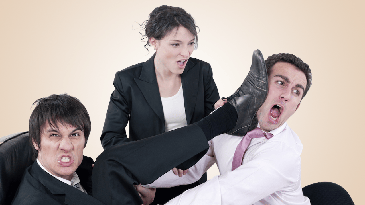 Three business people having a battle
