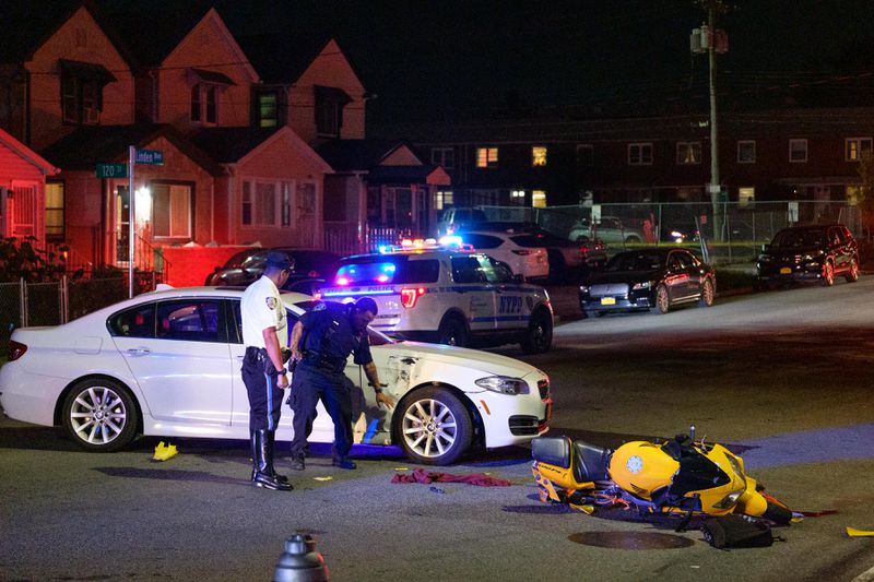 The NYPD Highway Patrol conducts an investigation of a collision