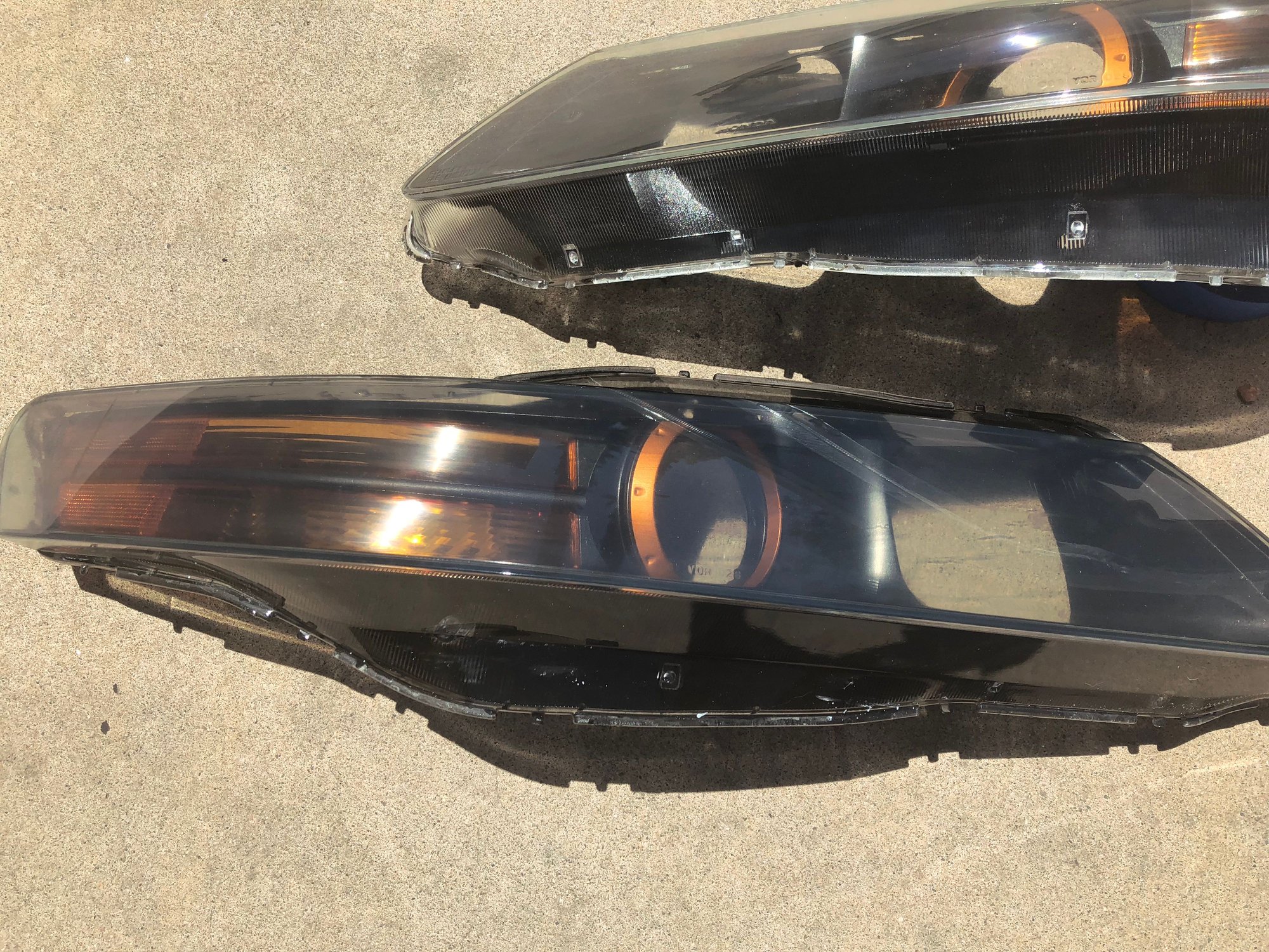 Sold: 04-06 acura tl headlights (blacked out and slightly tinted