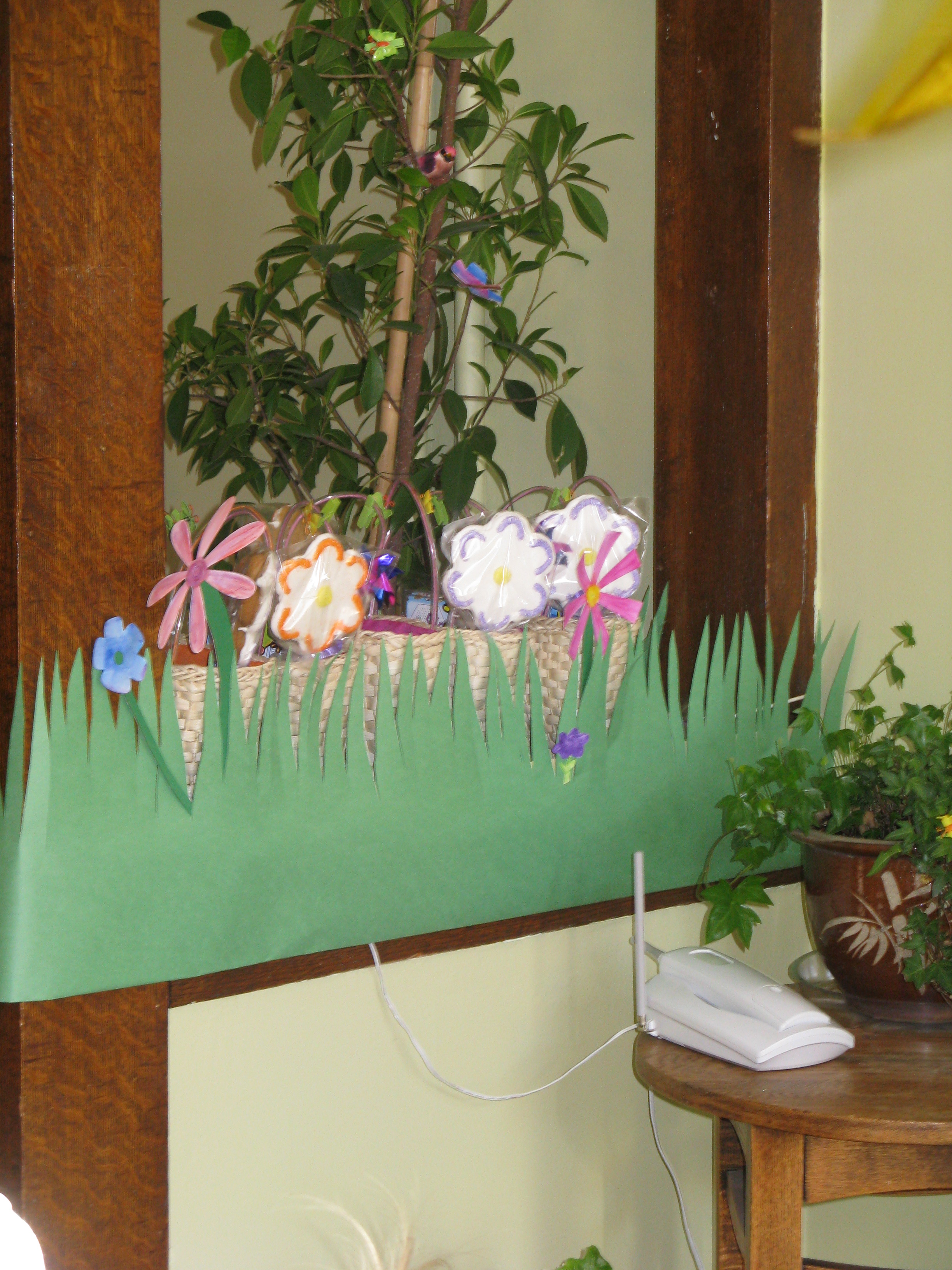 Decorated half walls. You can actually see the loot baskets with handmade flower cookies peeking out above the grass.