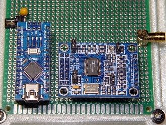 PHOTO 1 A knockoff Arduino Nano controls a generic AD9850 direct digital synthesizer circuit, both plugged into standard 0.1 inch headers, with hand-wiring connections below the proto board. The SMA connector provides a mechanically rugged output from the board; the DDS frequencies don’t require its RF properties.