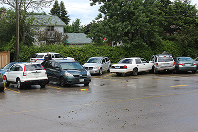 On the right side of the photo, the white Ford Crown Victoria that struck four students at ODSS earlier this afternoon before colliding with a grey Jeep. In the background, police speak to the operator of the vehicle, a teenaged male who has been arrested for dangerous driving causing bodily harm. One of the students that was hit in the collision has been transported to Headwaters Health Care Centre with serious, but non-life-threatening injuries.