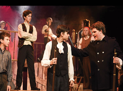 LOCAL BOY DUNCAN LANG (FAR RIGHT) has been taking the stage at Theatre Orangeville by storm. After starring in the recent production of Les Miserables, where he played the lead role of Jean Valjean, Mr. Lang is busy preparing for his next part - playing both Mr. Darling and Captain Hook in an upcoming production of Peter Pan.
