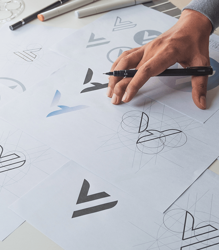 Graphic designer development process drawing sketch design creative Ideas draft Logo product trademark label brand artwork. Graphic designer studio Concept.