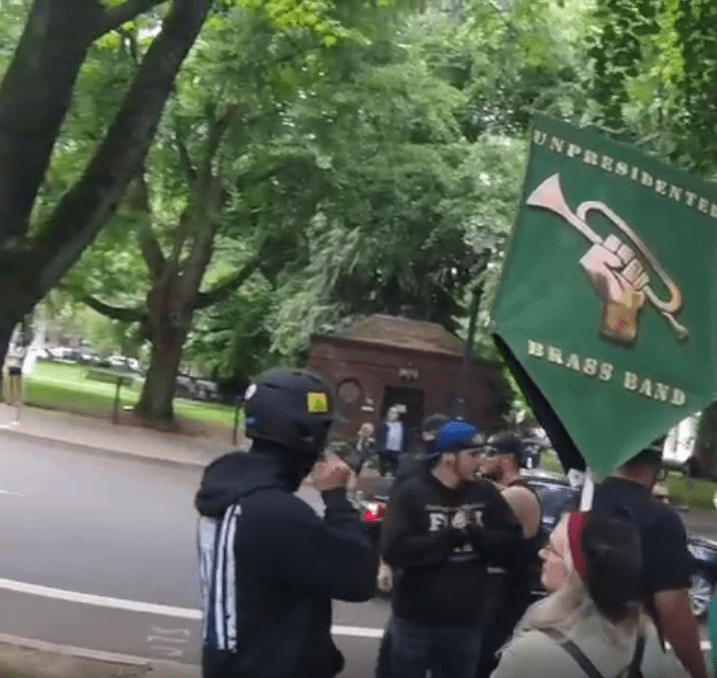 Mark McGuire's fascist cousin shows up in a baseball helmet, complete with standard-issue "Don't Tread on Me" sticker. Fuck Antifa guy #2 cracks his knuckles.