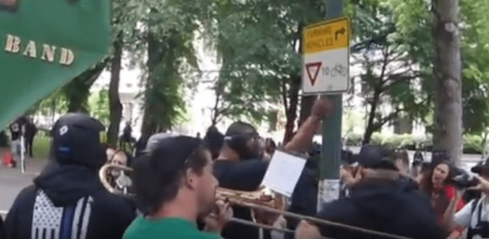 Tiny starts raising his hands in the air, a common intiidation tactic with him.