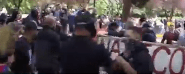 Tiny grabs for the person's clothing, and attempts to jerk him around.