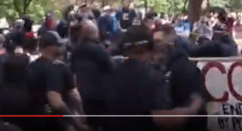 Tiny cocks his right arm back, to punch.