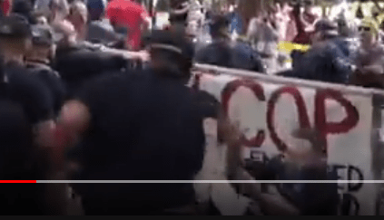 He then throws the person backwards, pushing them to the ground.