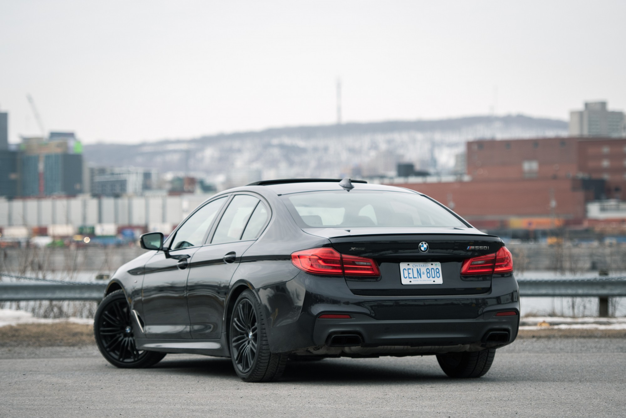 2020 bmw m550i rear three quarter
